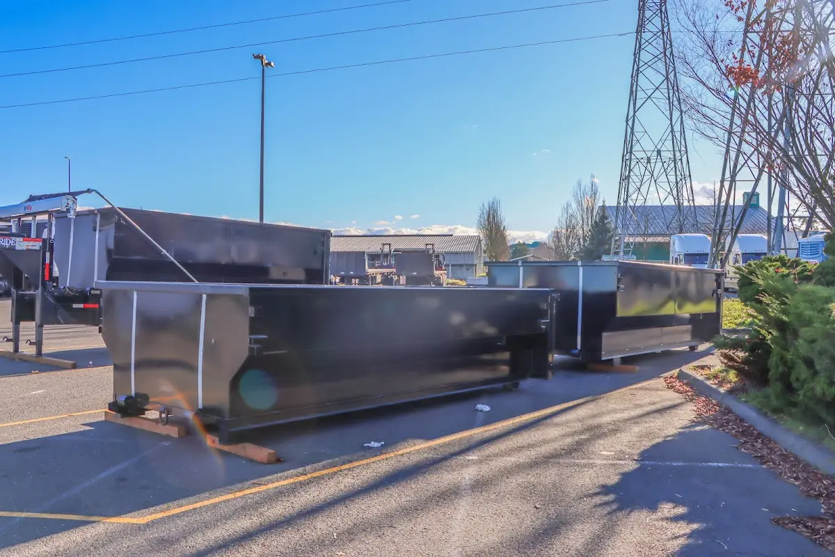 Roll-off dumpster ready for waste disposal at job site for Concrete Dumpster Rental in Gulfport